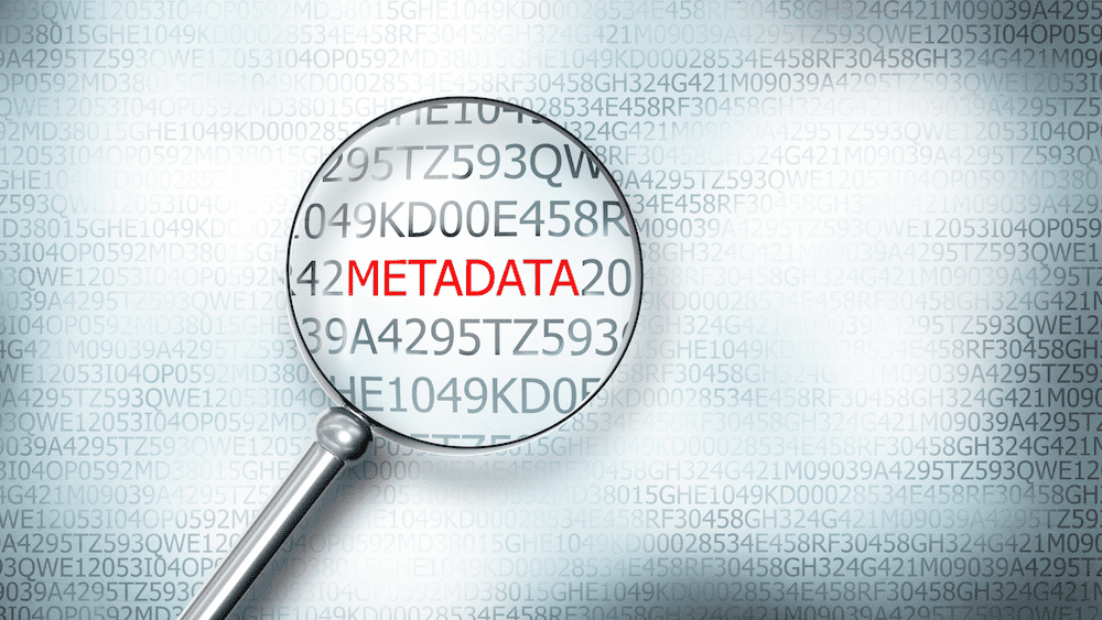 Metadata image showing code and the word "Metadata" in red being made clear with a magnifying glass.